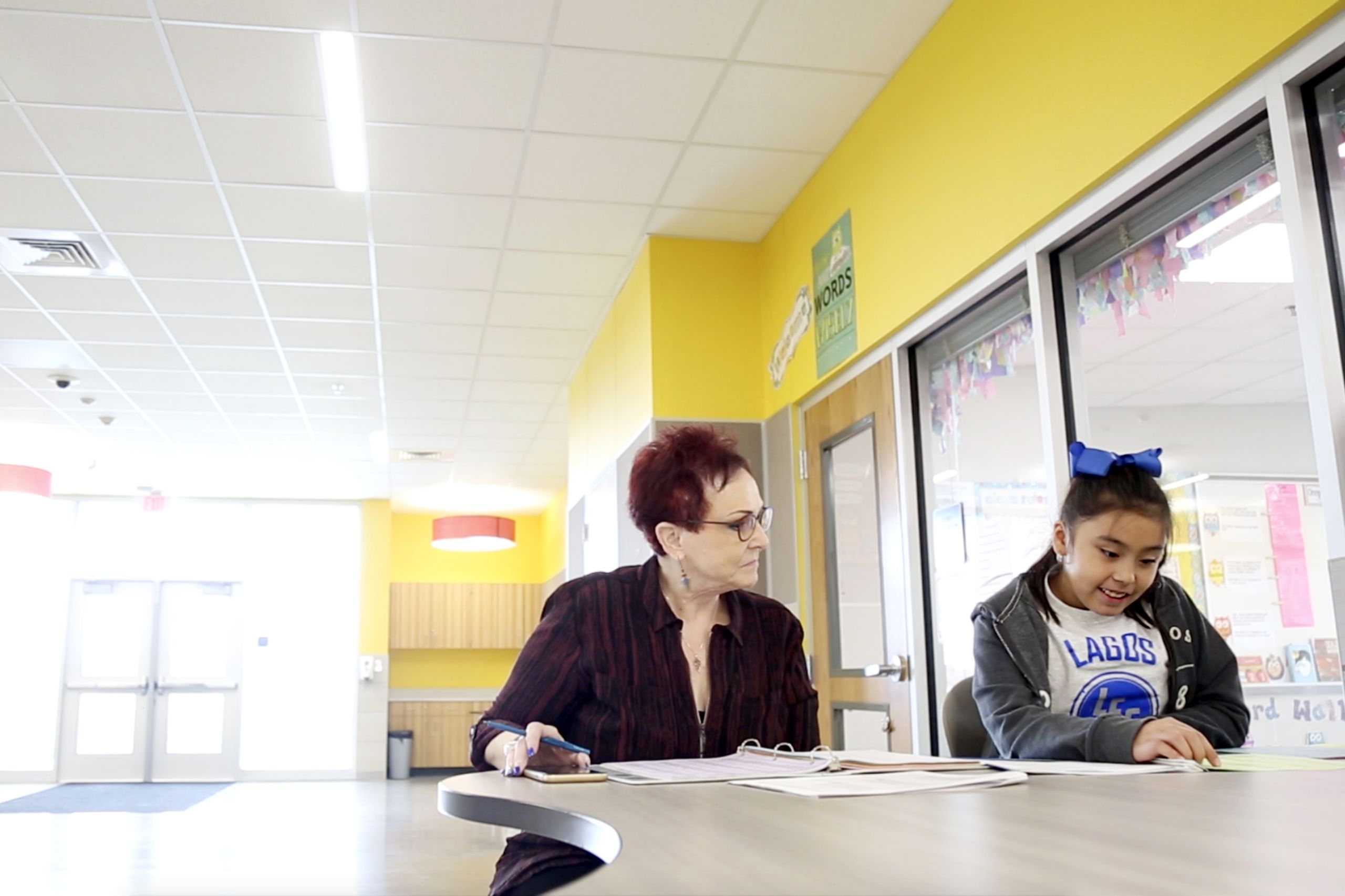 Pamela Gray, a literacy coach at Lagos Elementary, tests Kamila on the 1,000 words.